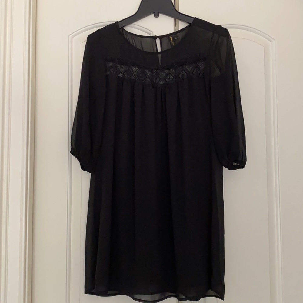 Black dress. Lined with sheer overlay.